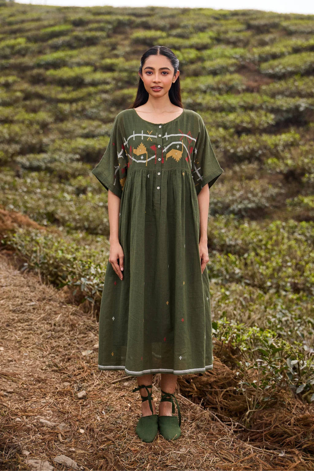 Sarron Harit Dress, dark mustard green cotton Jamdani dress with geometric bust motifs and French knots.