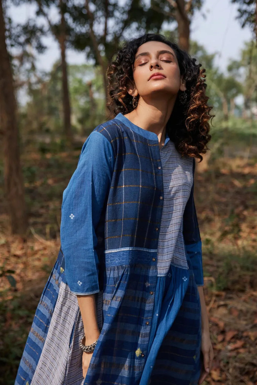 Sarron Indira Dress, blue cotton Jamdani dress with stripes, checks and handwoven Jamdani motifs.