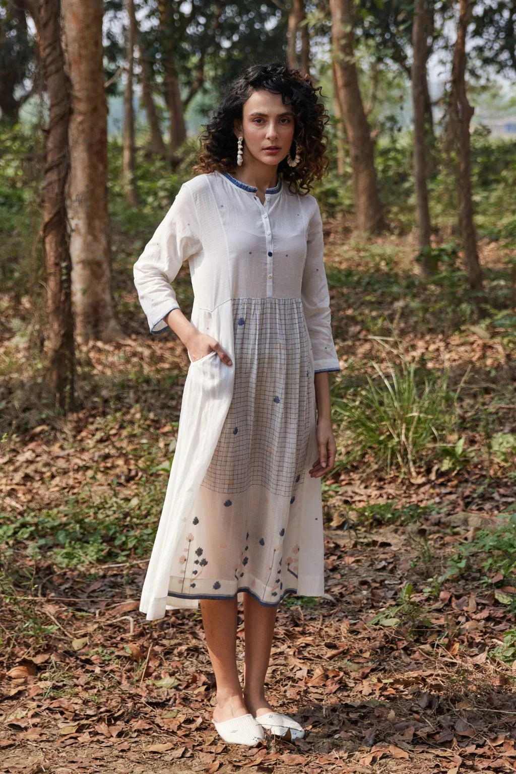 Sarron Kashvi Dress, crisp white cotton Jamdani dress with handwoven blue butas and a button placket.