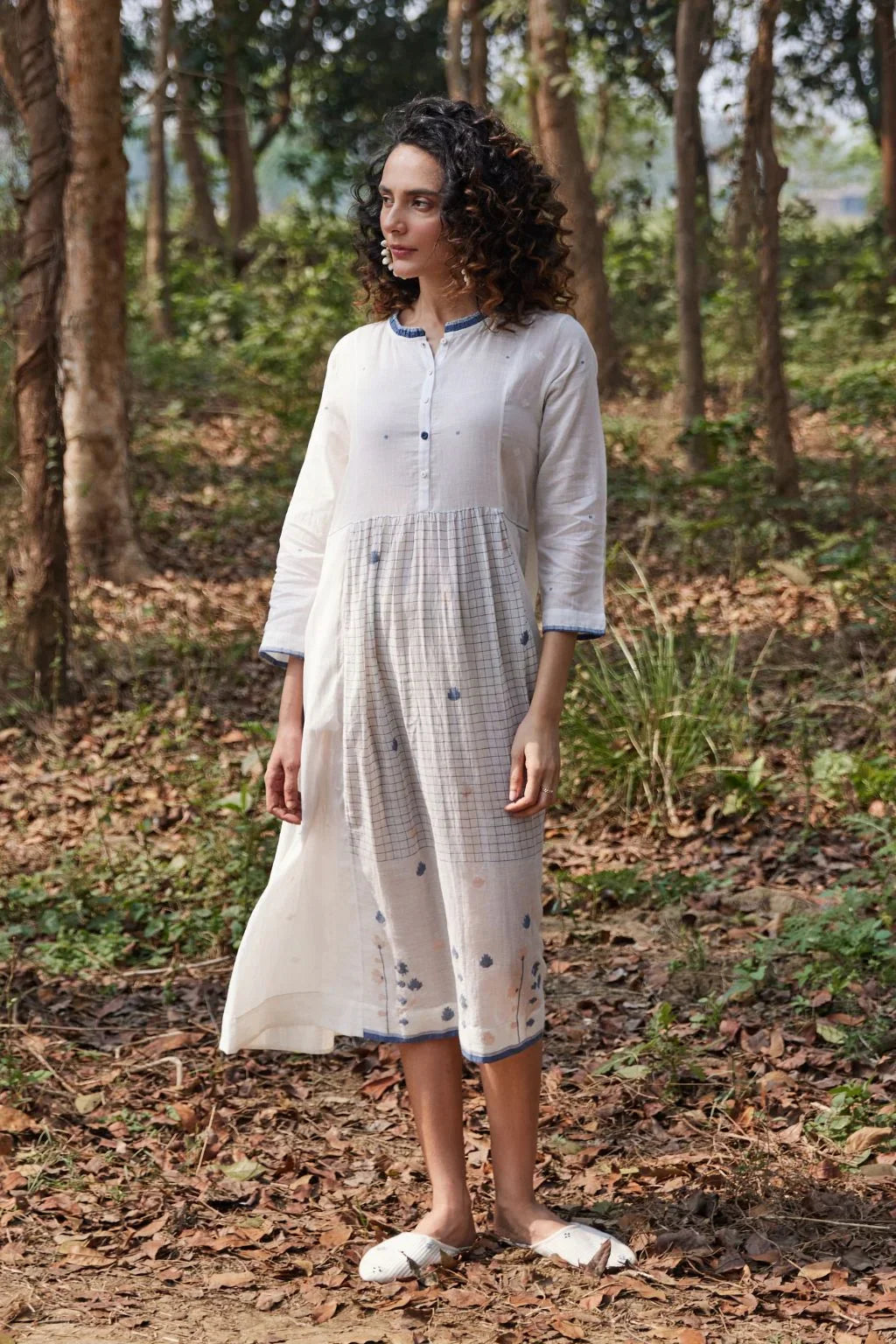 Sarron Kashvi Dress, crisp white cotton Jamdani dress with handwoven blue butas and a button placket.
