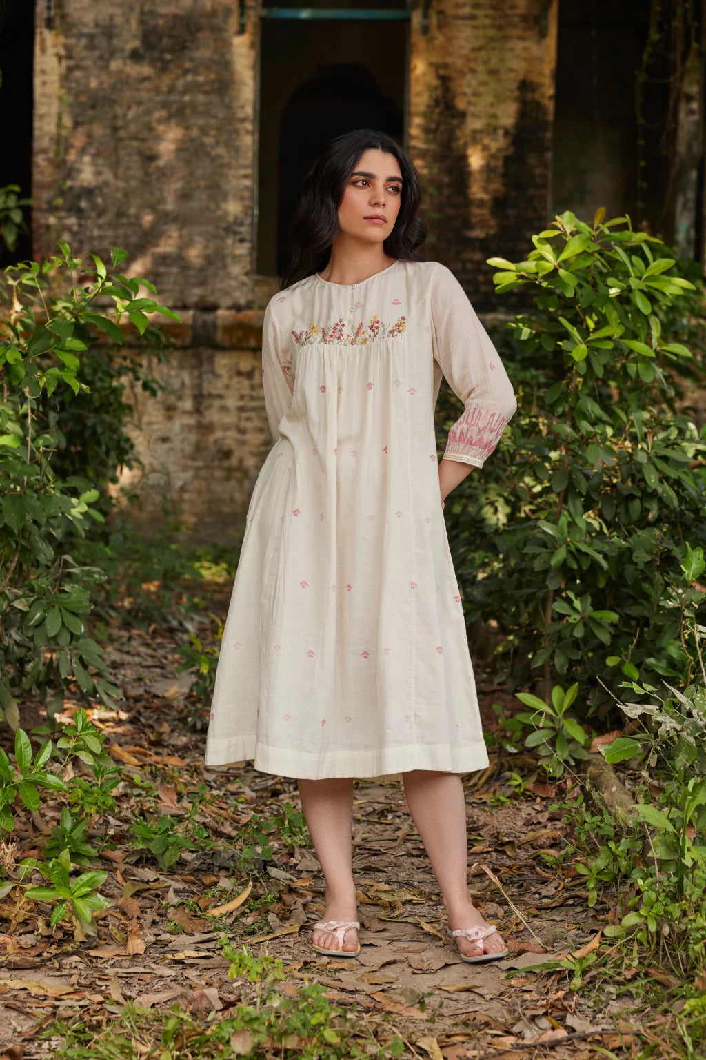 Sarron Khanak Dress, off-white cotton Jamdani dress with red and copper zari motifs and floral hand embroidery.