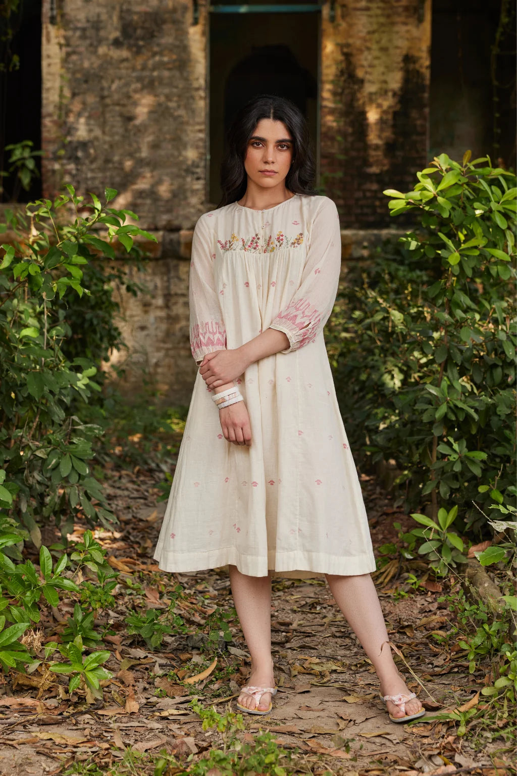 Sarron Khanak Dress, off-white cotton Jamdani dress with red and copper zari motifs and floral hand embroidery.