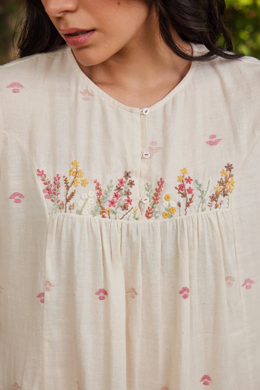 Sarron Khanak Dress, off-white cotton Jamdani dress with red and copper zari motifs and floral hand embroidery.