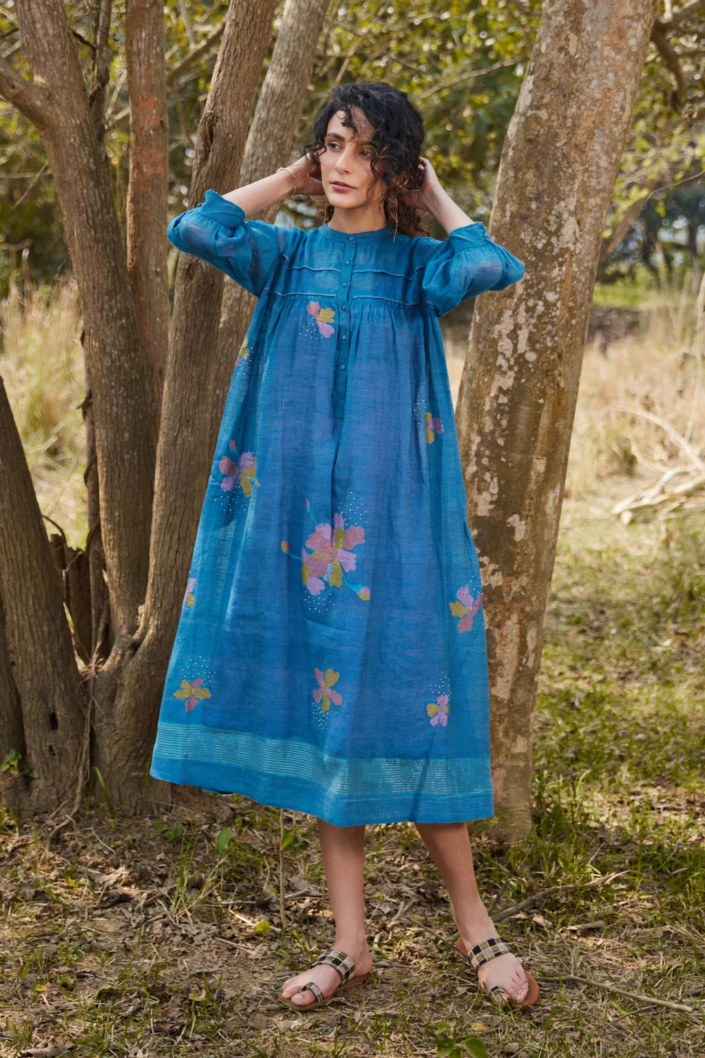 Sarron Krishna Dress, blue silk-cotton Jamdani dress with handwoven floral motifs and a pleated fall.