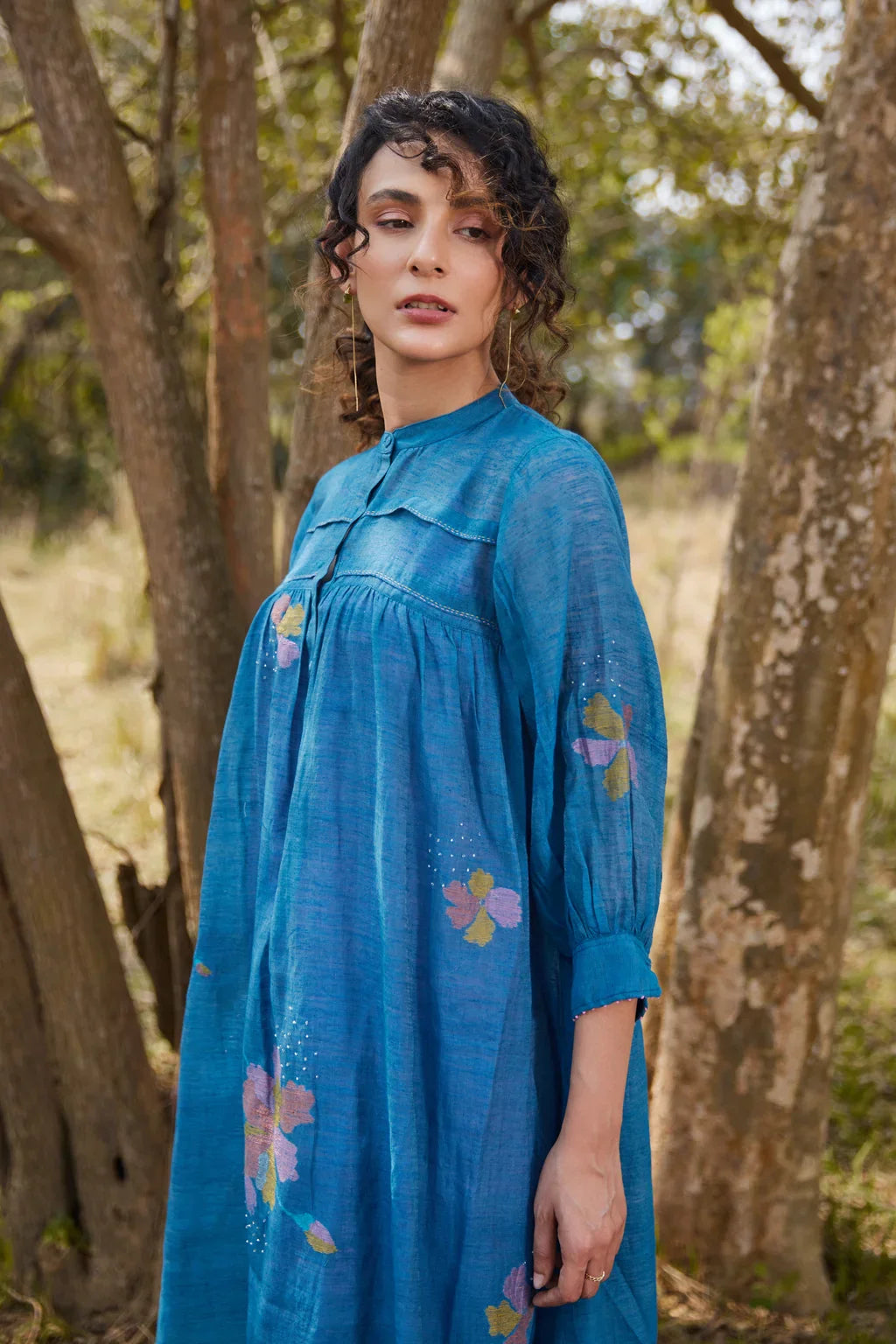 Sarron Krishna Dress, blue silk-cotton Jamdani dress with handwoven floral motifs and a pleated fall.