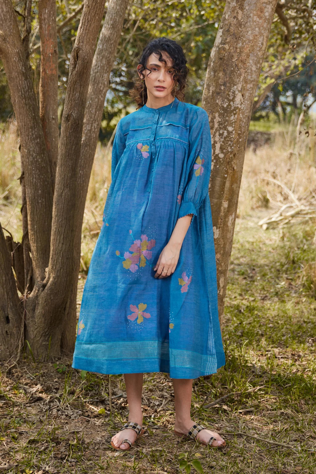 Sarron Krishna Dress, blue silk-cotton Jamdani dress with handwoven floral motifs and a pleated fall.
