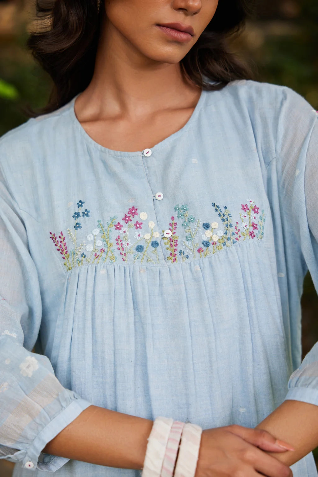 Sarron Kusum Dress, light blue cotton Jamdani dress with white and gold zari floral motifs.