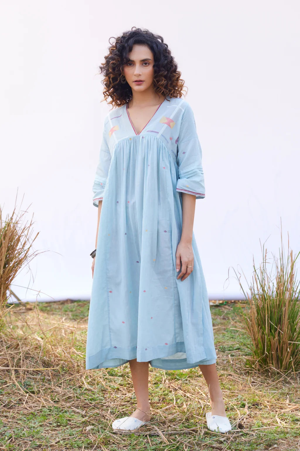Sarron Meghna Dress, light indigo cotton Jamdani dress with a V-neckline and handwoven Jamdani motifs.