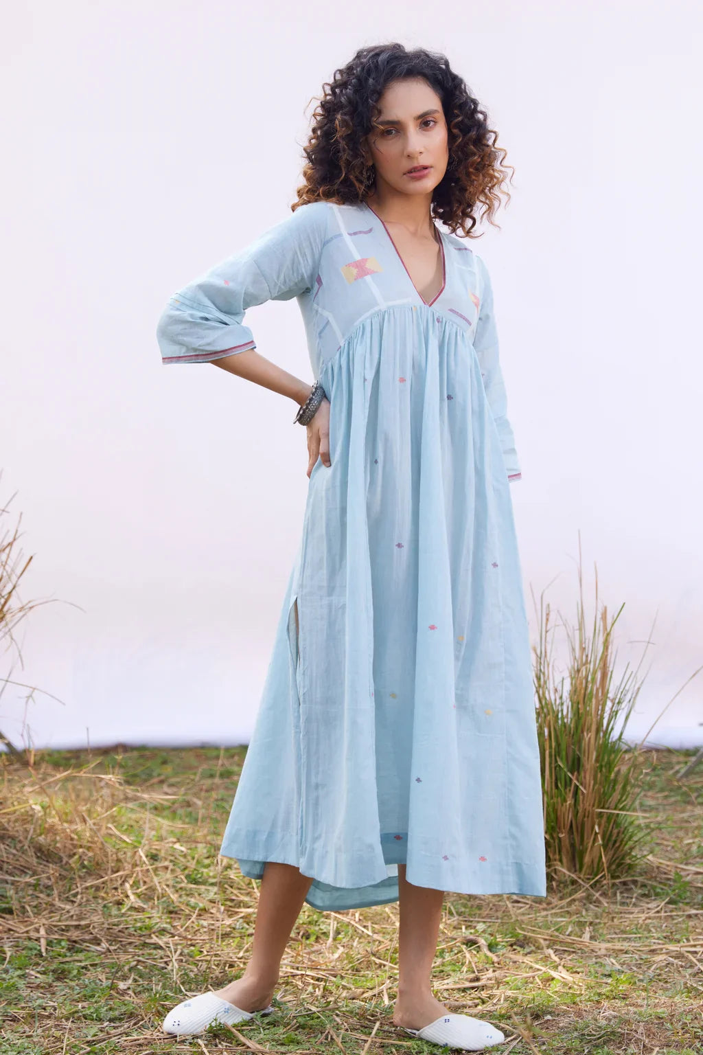 Sarron Meghna Dress, light indigo cotton Jamdani dress with a V-neckline and handwoven Jamdani motifs.