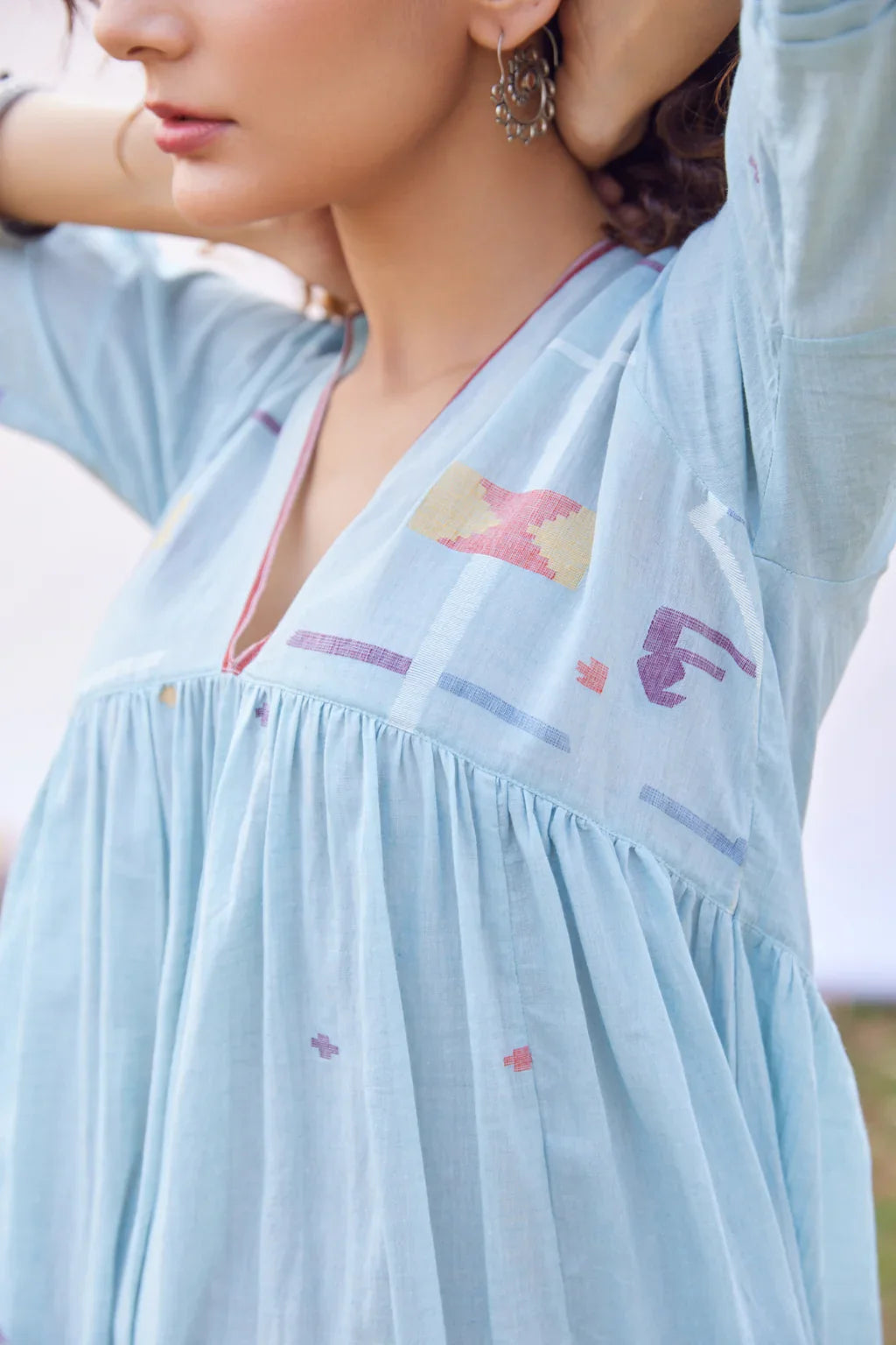 Sarron Meghna Dress, light indigo cotton Jamdani dress with a V-neckline and handwoven Jamdani motifs.