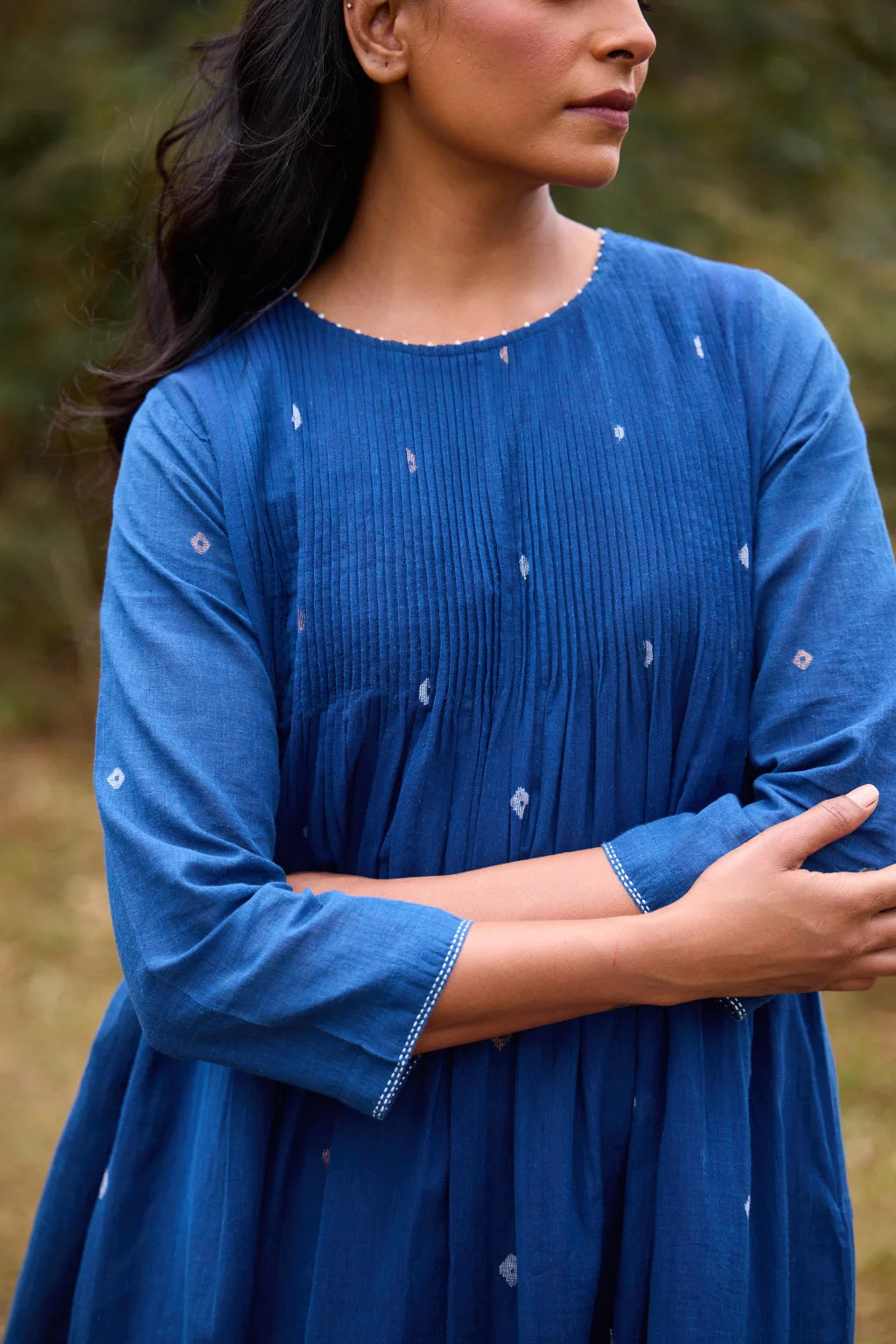 Sarron Neelpadma Dress, deep indigo cotton Jamdani flare dress with geometric hem motifs and pintucks.
