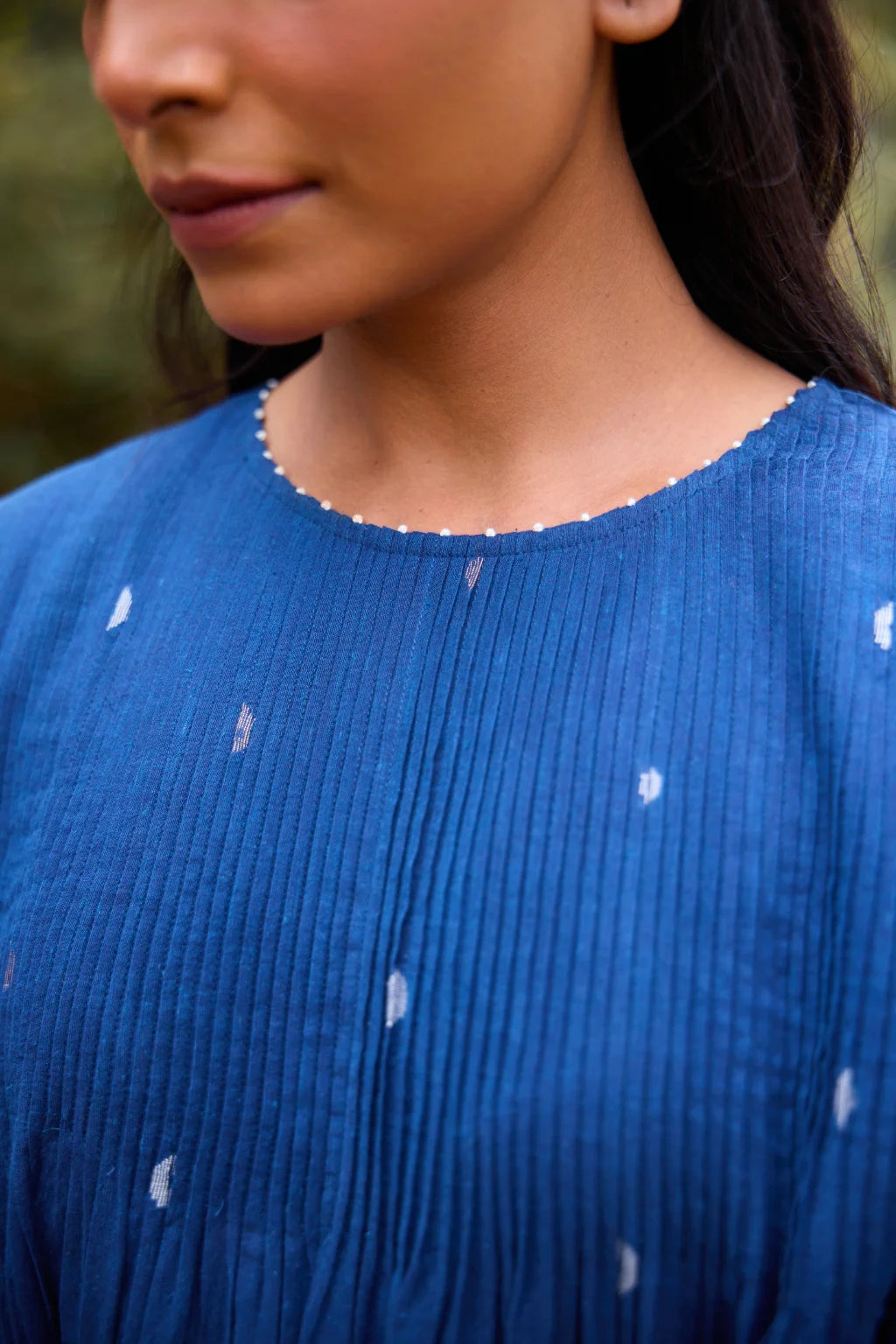 Sarron Neelpadma Dress, deep indigo cotton Jamdani flare dress with geometric hem motifs and pintucks.