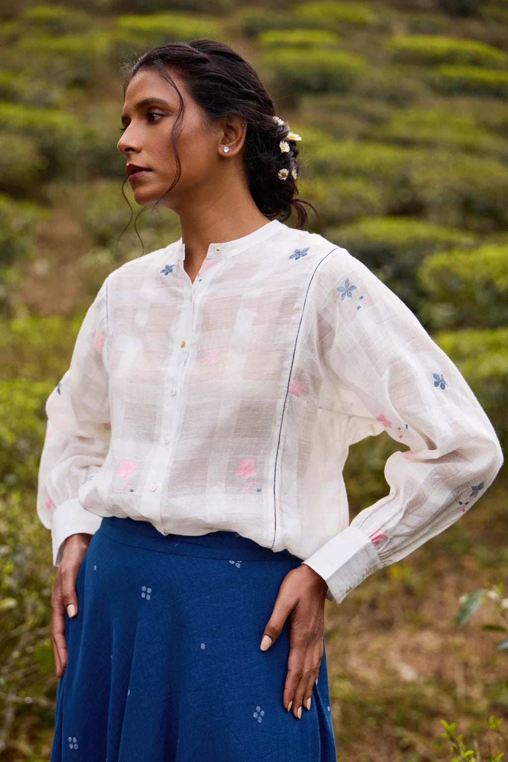 Sarron Neeltara Shirt, loose white silk-cotton Jamdani shirt with handwoven blue and pink flower motifs.