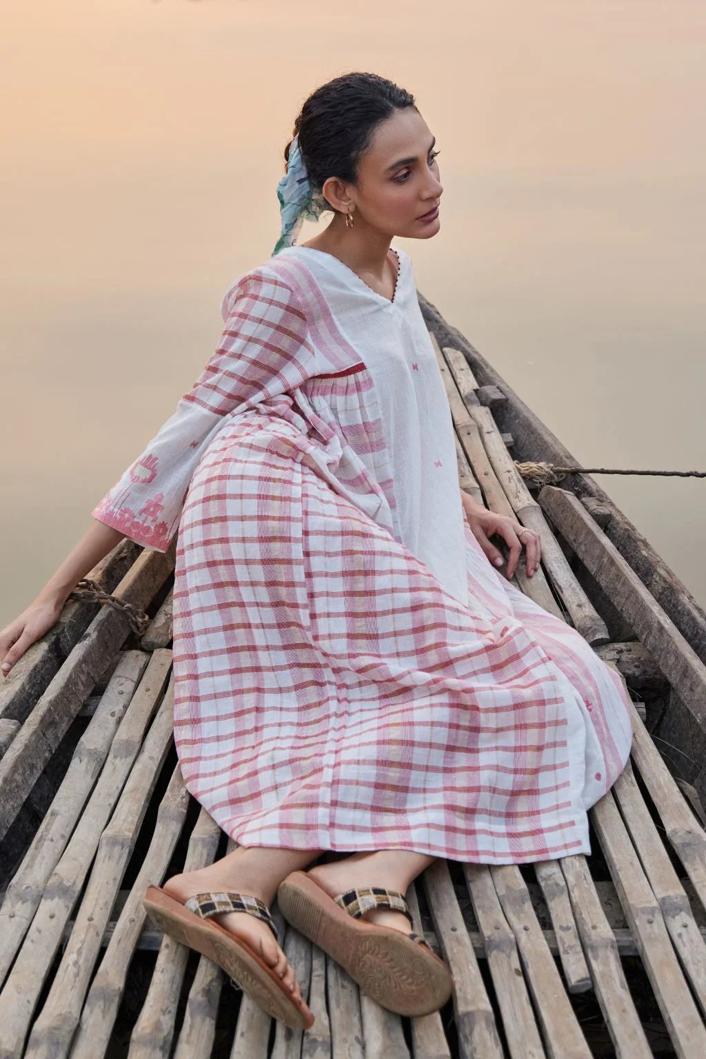 Sarron Neha Dress, white cotton zari Jamdani dress with handwoven red stripes and a V-neckline.