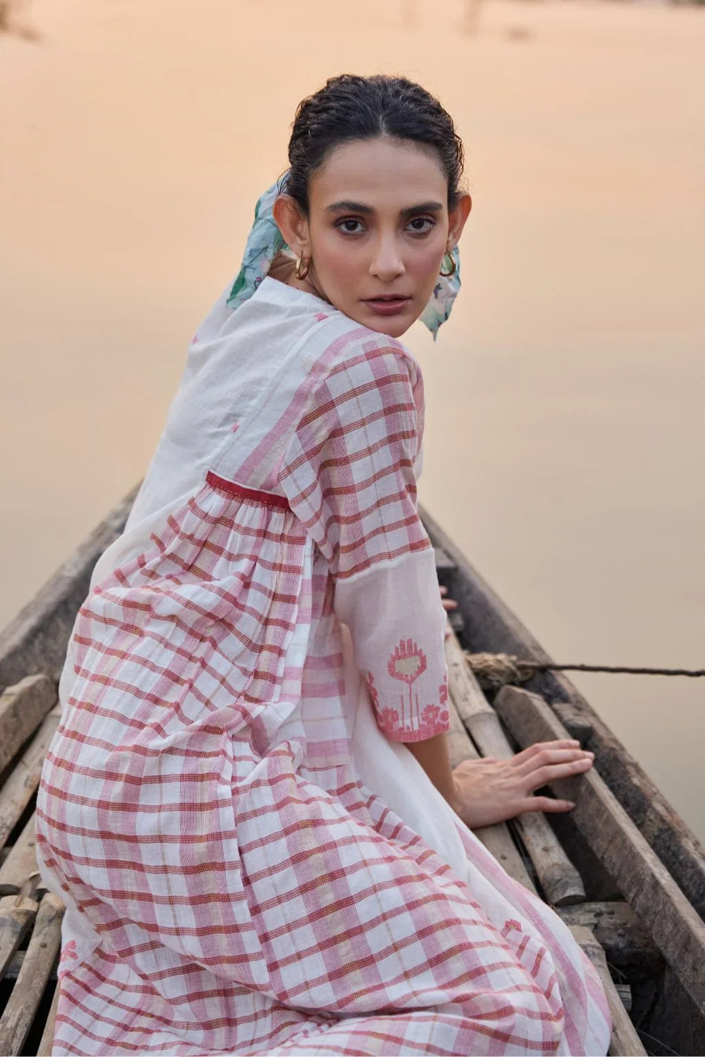 Sarron Neha Dress, white cotton zari Jamdani dress with handwoven red stripes and a V-neckline.