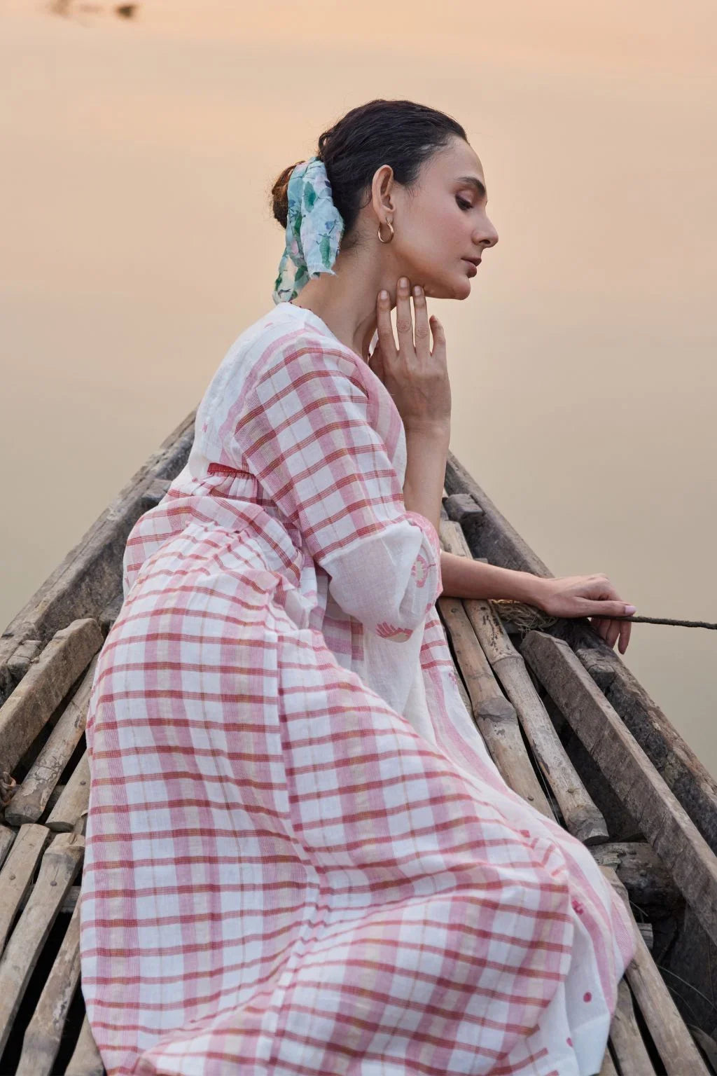 Sarron Neha Dress, white cotton zari Jamdani dress with handwoven red stripes and a V-neckline.