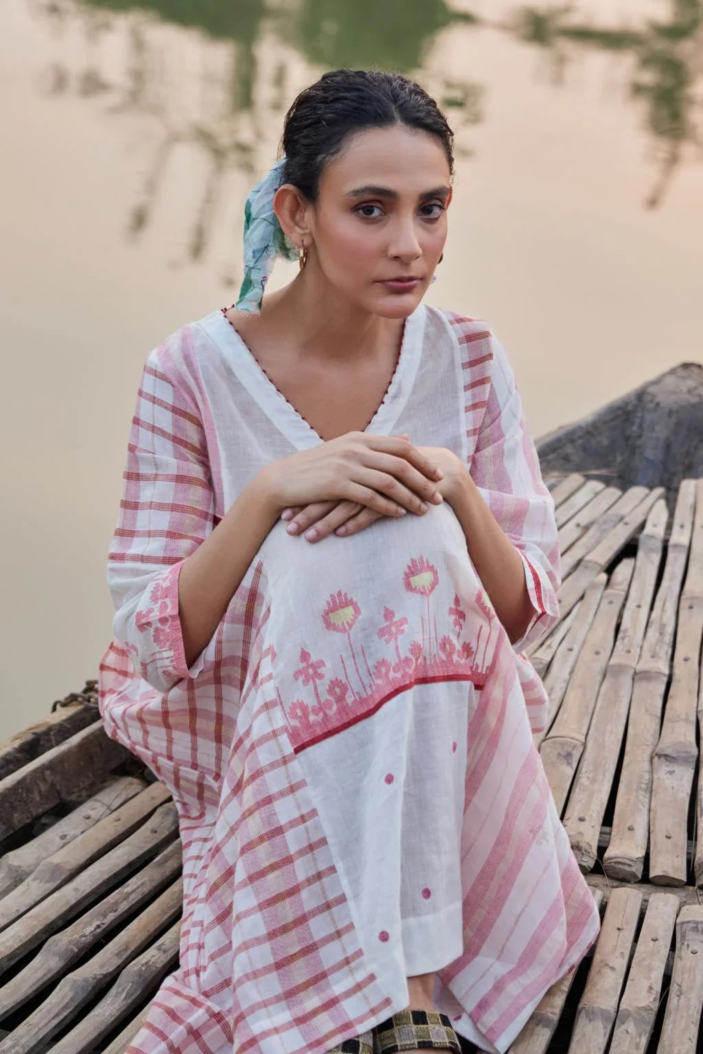 Sarron Neha Dress, white cotton zari Jamdani dress with handwoven red stripes and a V-neckline.