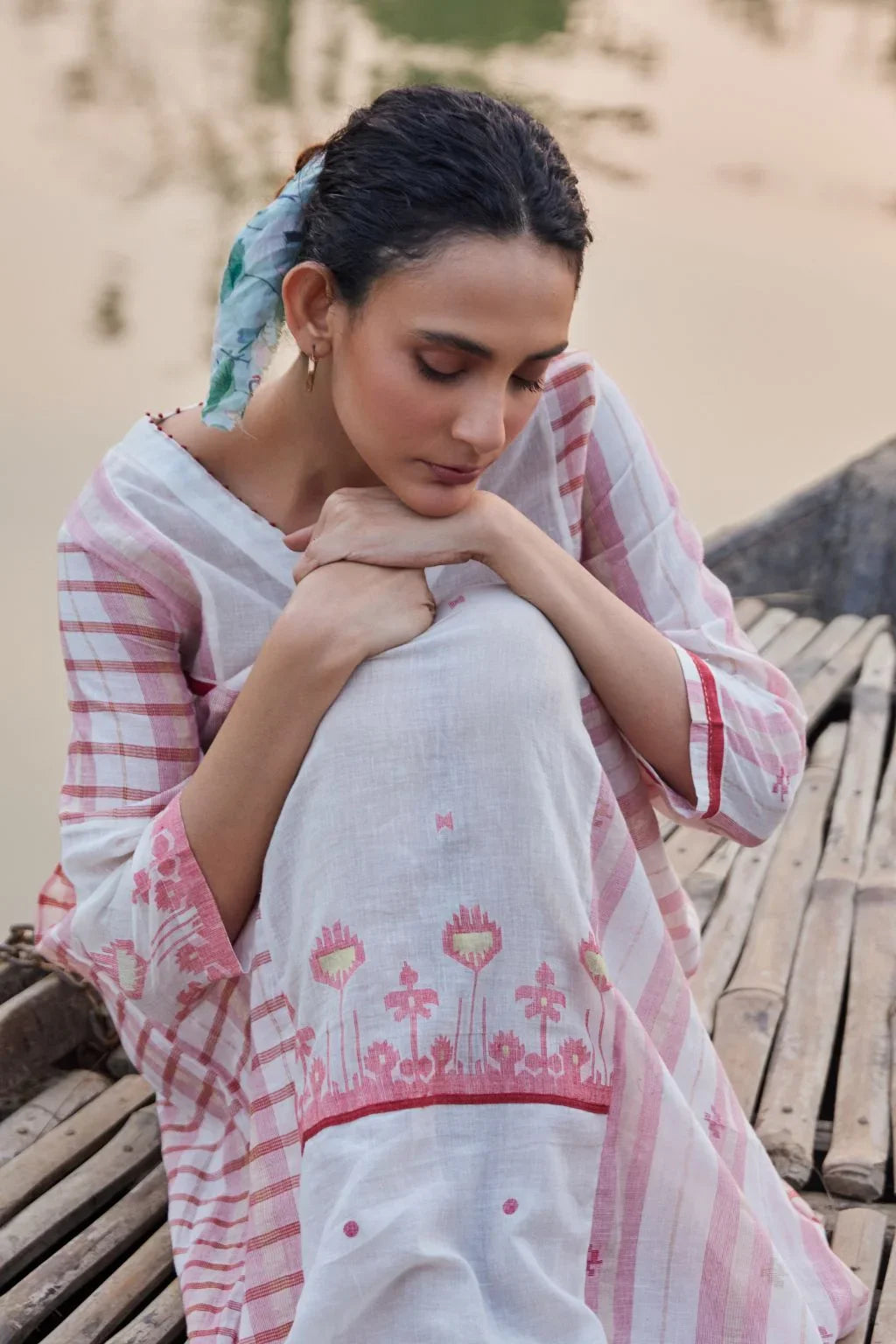 Sarron Neha Dress, white cotton zari Jamdani dress with handwoven red stripes and a V-neckline.