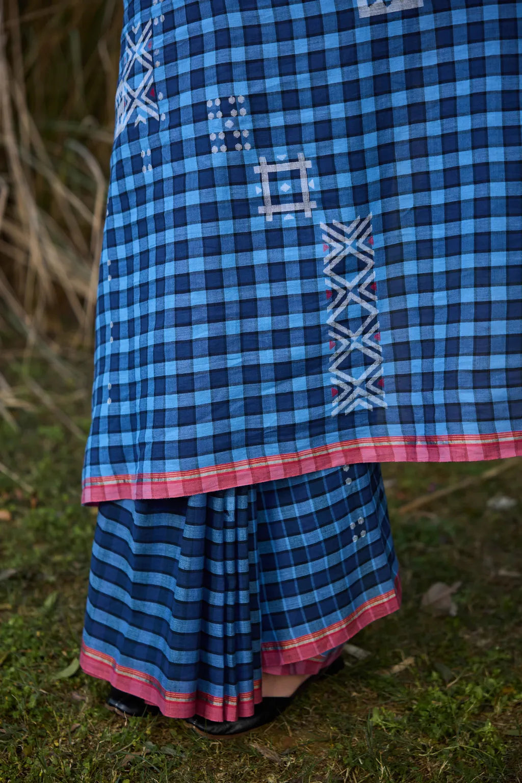 Sarron Nila-001 Saree, indigo checked cotton Jamdani saree with abstract geometric motifs and red selvedge.