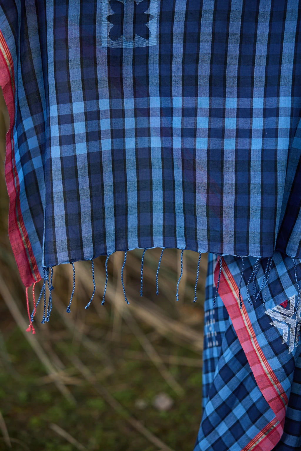 Sarron Nila-001 Saree, indigo checked cotton Jamdani saree with abstract geometric motifs and red selvedge.