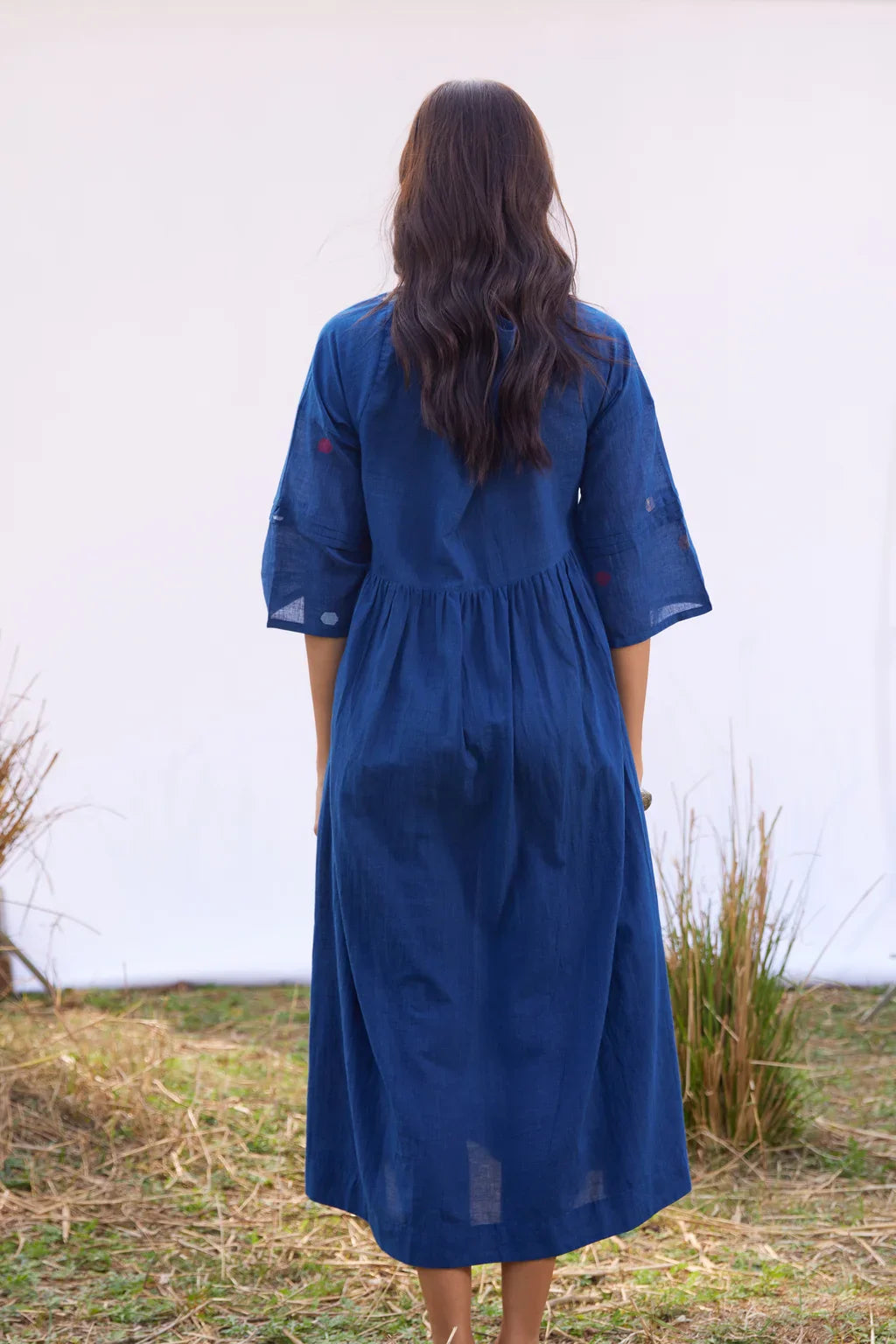 Sarron Nilu Dress, dark indigo cotton Jamdani dress with scattered geometric motifs and side slits.