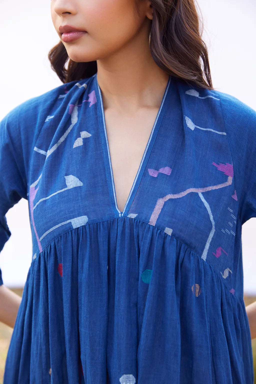 Sarron Nilu Dress, dark indigo cotton Jamdani dress with scattered geometric motifs and side slits.