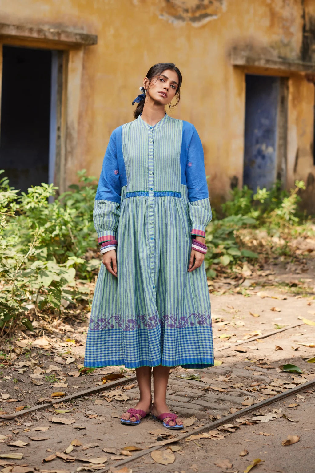 Sarron Nishita Dress, blue and green patchwork cotton Jamdani dress with geometric and floral motifs.