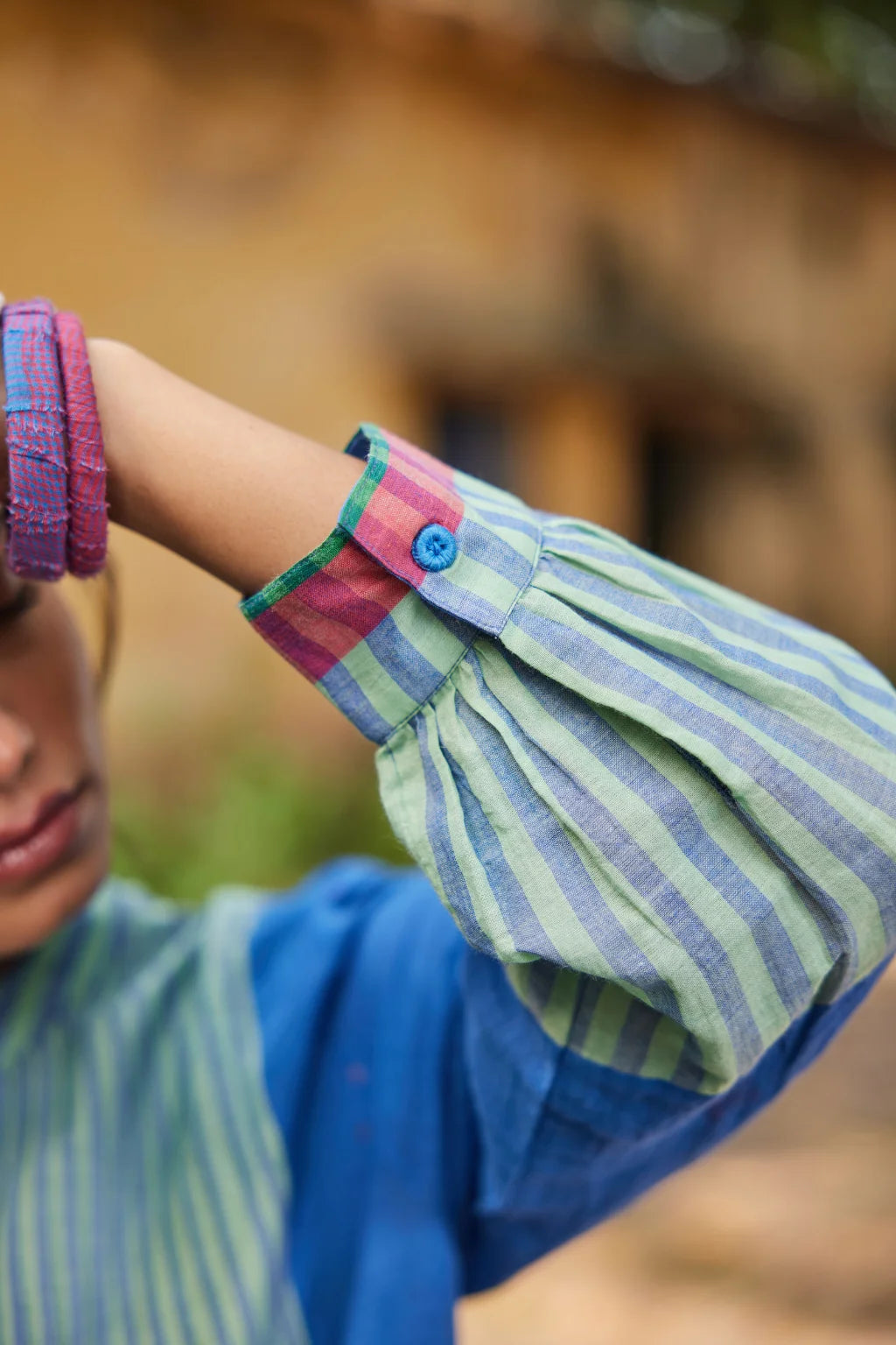 Sarron Nishita Dress, blue and green patchwork cotton Jamdani dress with geometric and floral motifs.