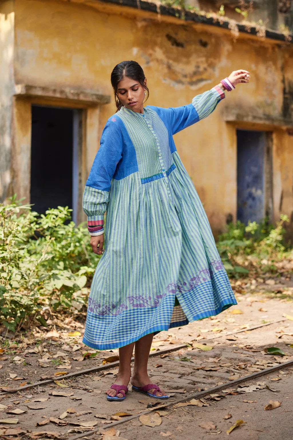 Sarron Nishita Dress, blue and green patchwork cotton Jamdani dress with geometric and floral motifs.