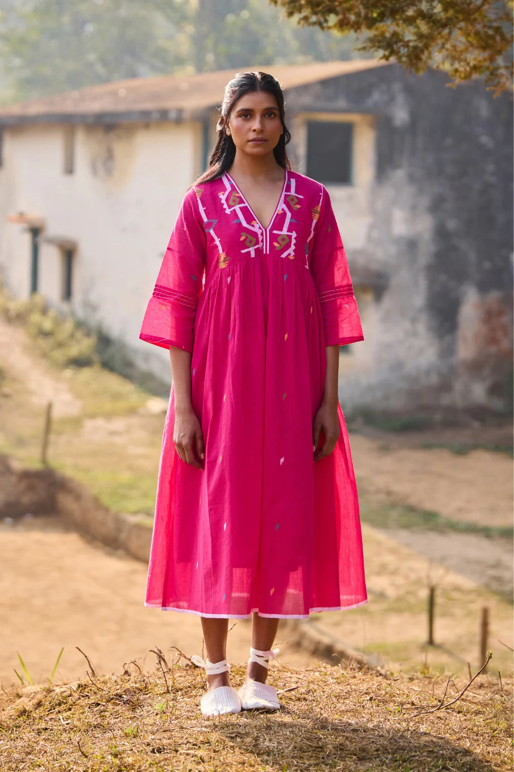 Sarron Raktima Dress, pink cotton Jamdani dress with a large geometric yoke motif and Kantha-worked sleeves.