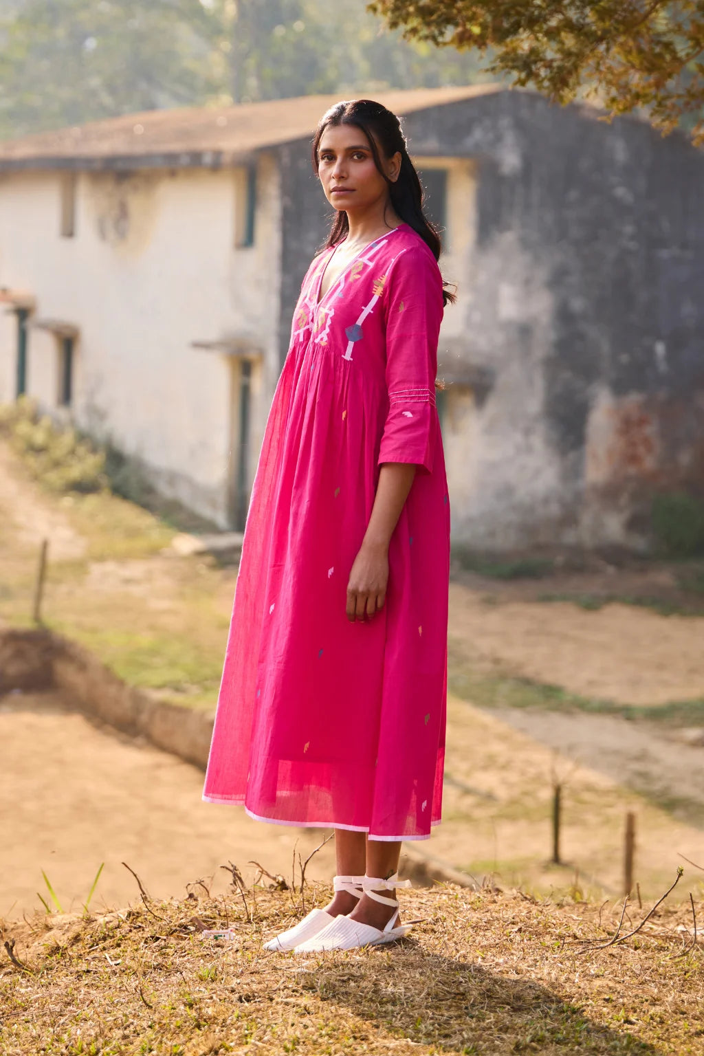 Sarron Raktima Dress, pink cotton Jamdani dress with a large geometric yoke motif and Kantha-worked sleeves.