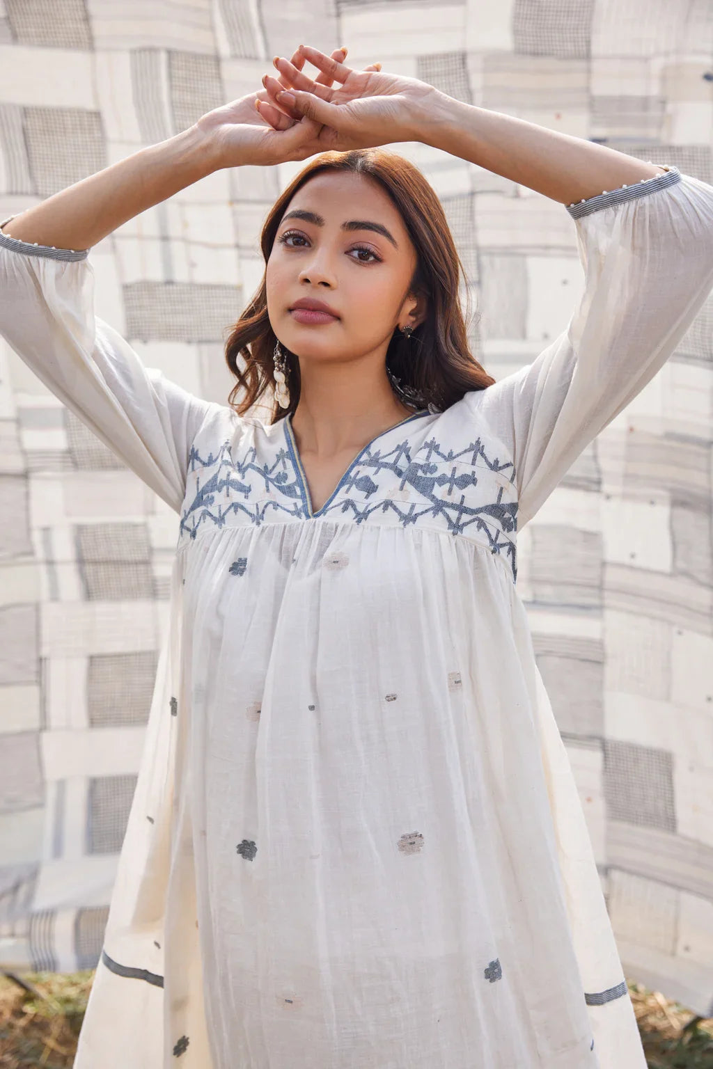 Sarron Ranjita Dress, off-white cotton Jamdani dress with handwoven blue motifs and a worked neckline.