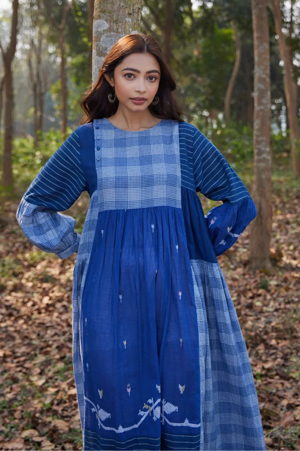 Sarron Ritu Dress, blue and grey striped cotton Jamdani maxi dress with a flared hem and side pockets.