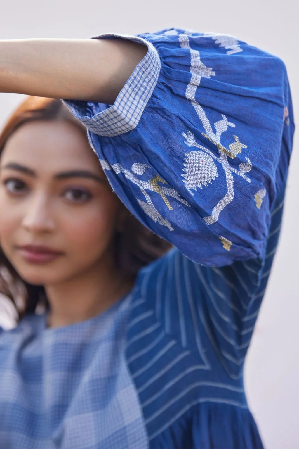 Sarron Ritu Dress, blue and grey striped cotton Jamdani maxi dress with a flared hem and side pockets.