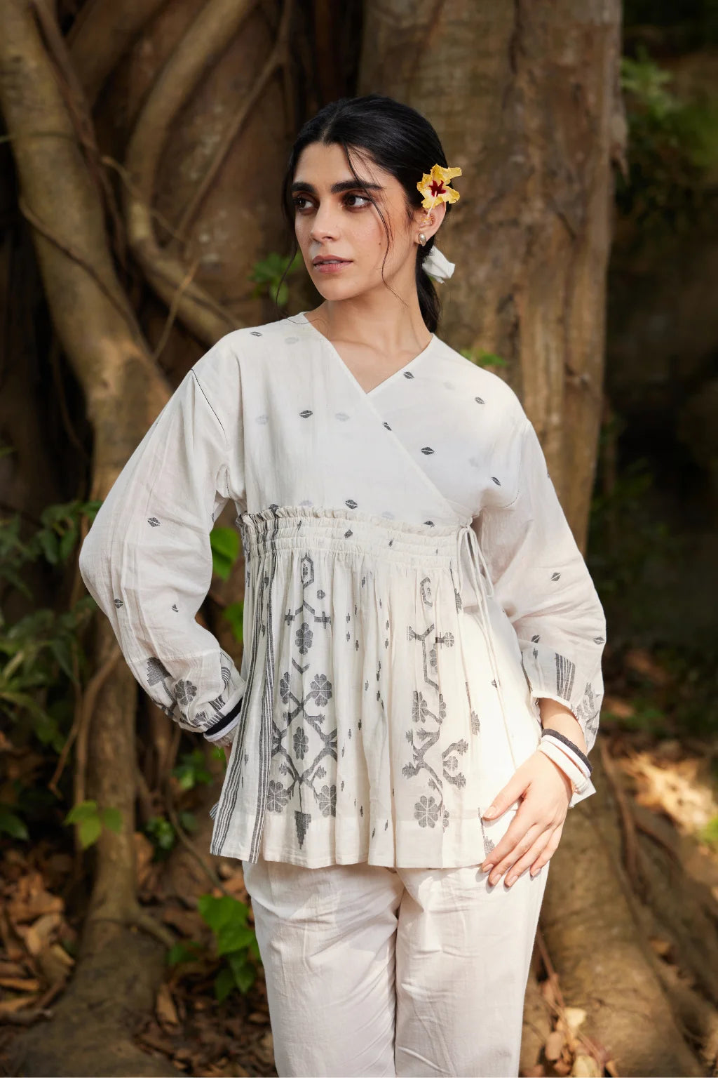 Sarron Rumela Top, white angrakha-style cotton Jamdani top with black geometric and floral motifs.