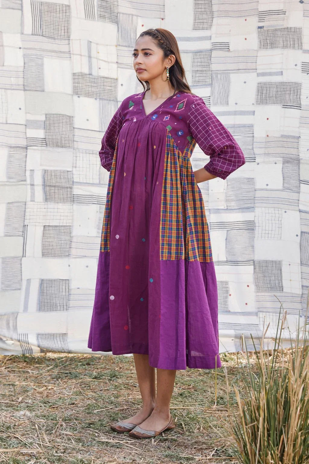 Sarron Sana Dress, red cotton Jamdani dress with multicoloured stripe panels and a V-neckline.