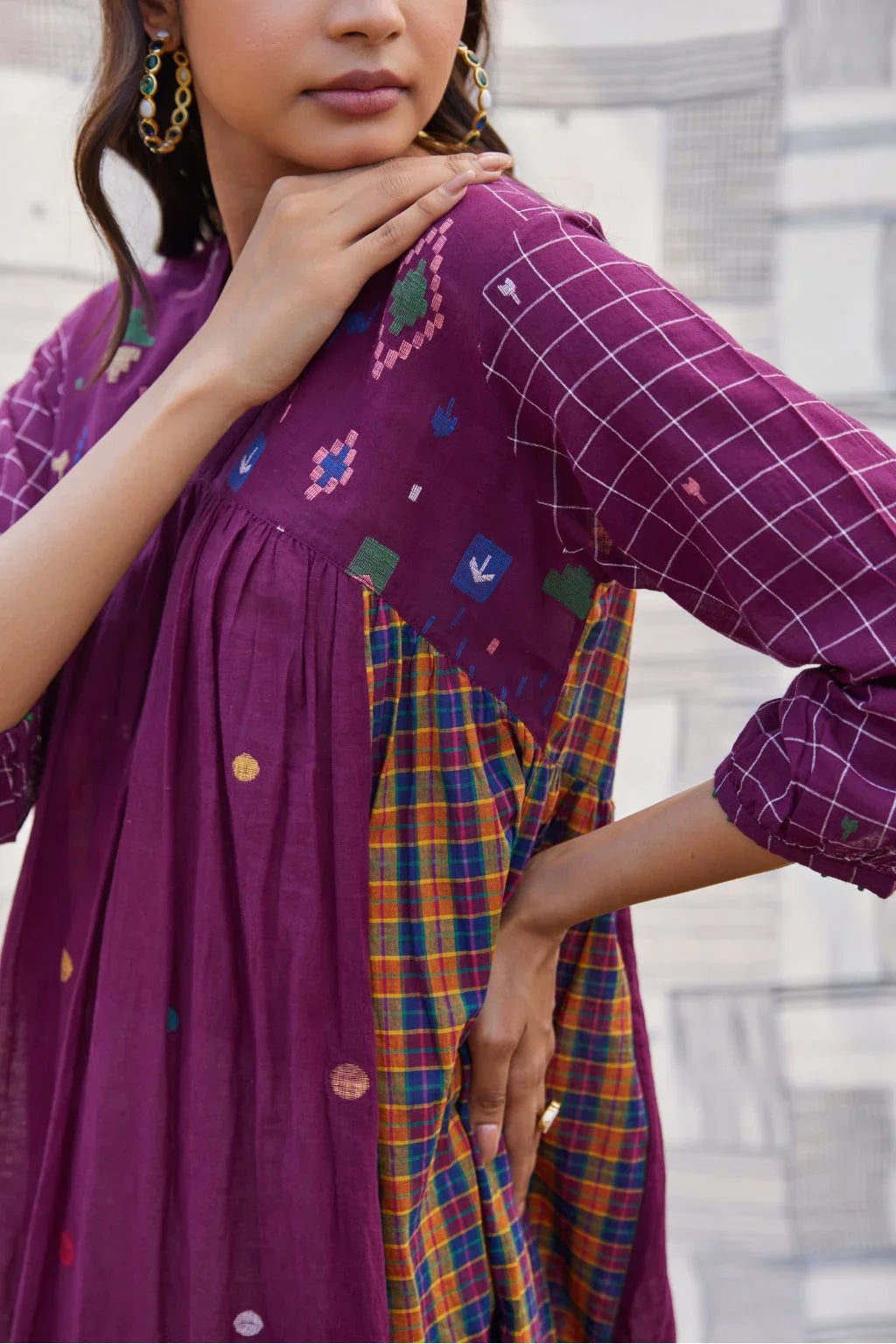 Sarron Sana Dress, red cotton Jamdani dress with multicoloured stripe panels and a V-neckline.