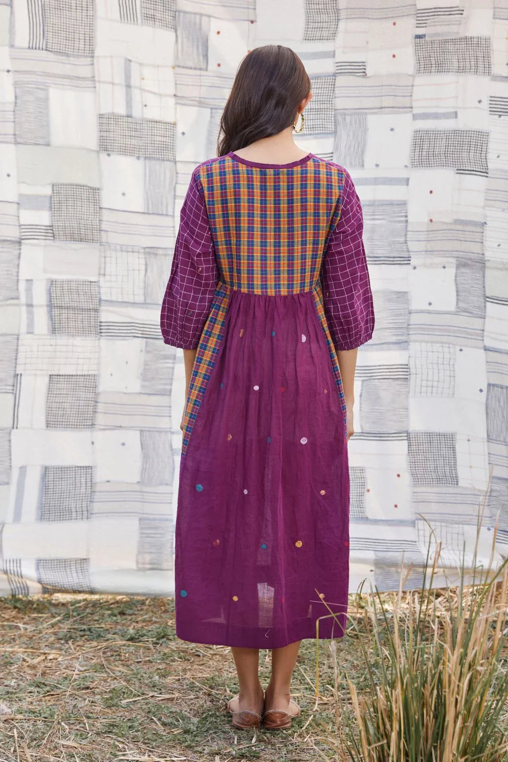 Sarron Sana Dress, red cotton Jamdani dress with multicoloured stripe panels and a V-neckline.