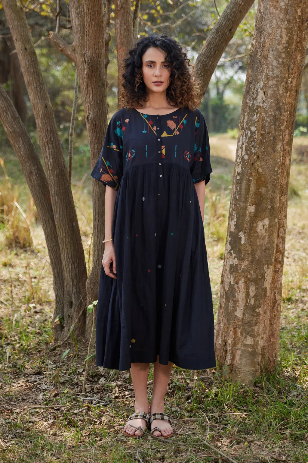 Sarron Shila Dress, solid black cotton Jamdani dress, calf length with a round neck and half sleeves.