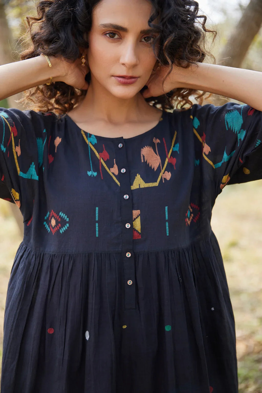 Sarron Shila Dress, solid black cotton Jamdani dress, calf length with a round neck and half sleeves.