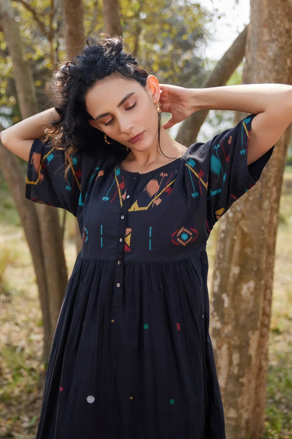 Sarron Shila Dress, solid black cotton Jamdani dress, calf length with a round neck and half sleeves.