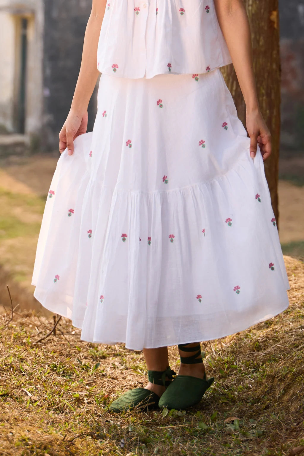 Sarron Shiuli Skirt, white flared cotton Jamdani skirt with geometric flower motifs and side pockets.