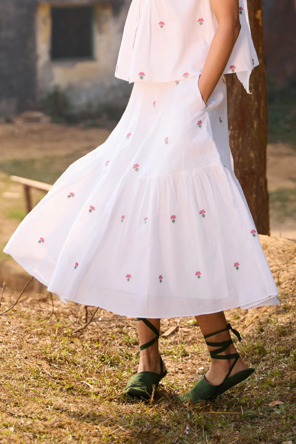 Sarron Shiuli Skirt, white flared cotton Jamdani skirt with geometric flower motifs and side pockets.