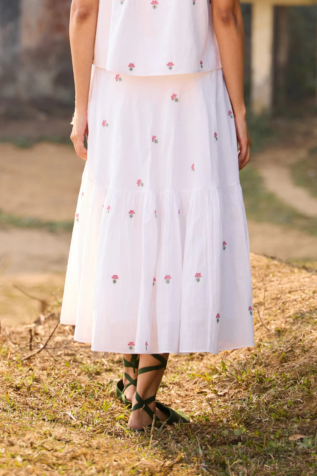Sarron Shiuli Skirt, white flared cotton Jamdani skirt with geometric flower motifs and side pockets.