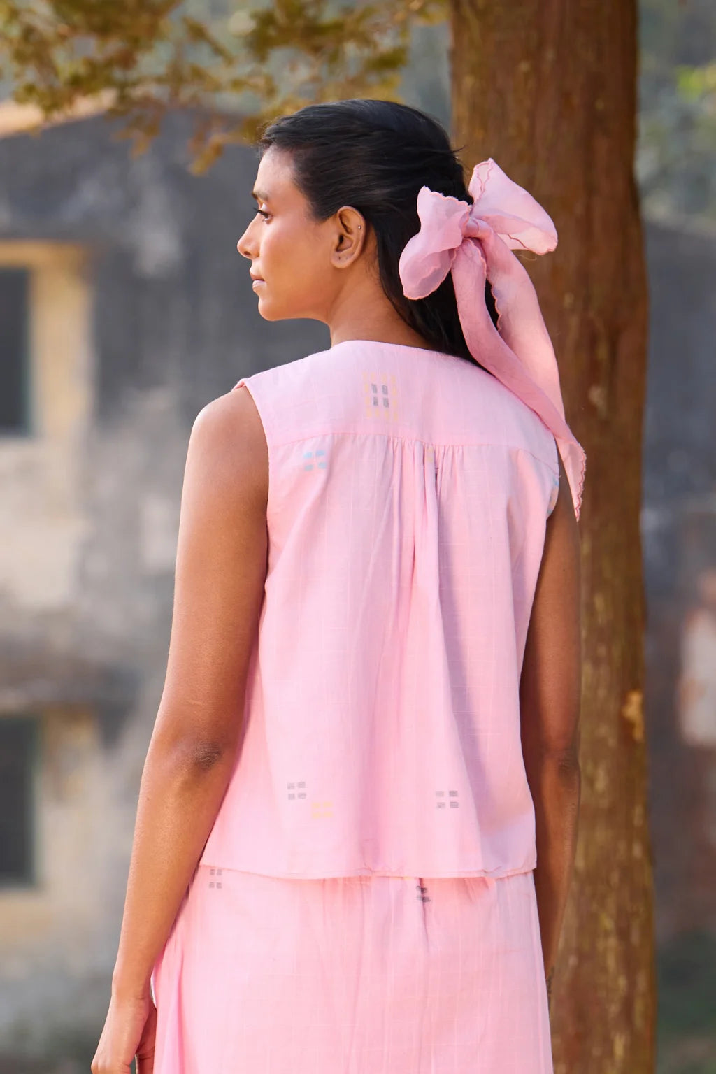 Sarron Shonpakhi Top, sleeveless pink checked cotton Jamdani top with geometric motifs and pintucks.