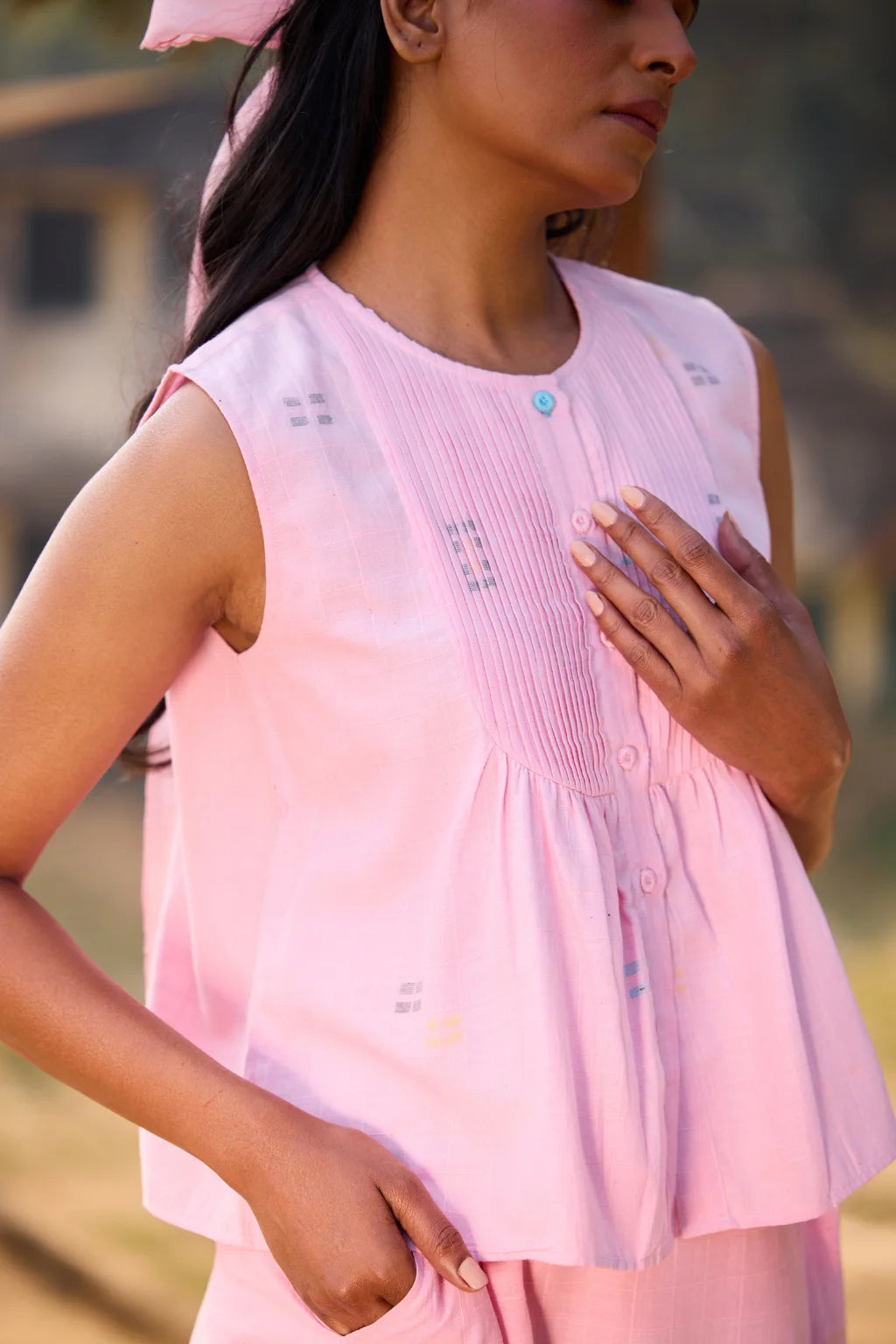 Sarron Shonpakhi Top, sleeveless pink checked cotton Jamdani top with geometric motifs and pintucks.