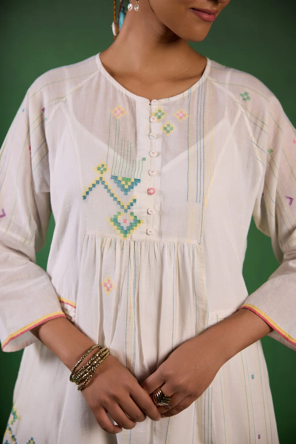 Sarron Shuchi Dress, soft white silk-cotton Jamdani dress with large handwoven motifs and raglan sleeves.
