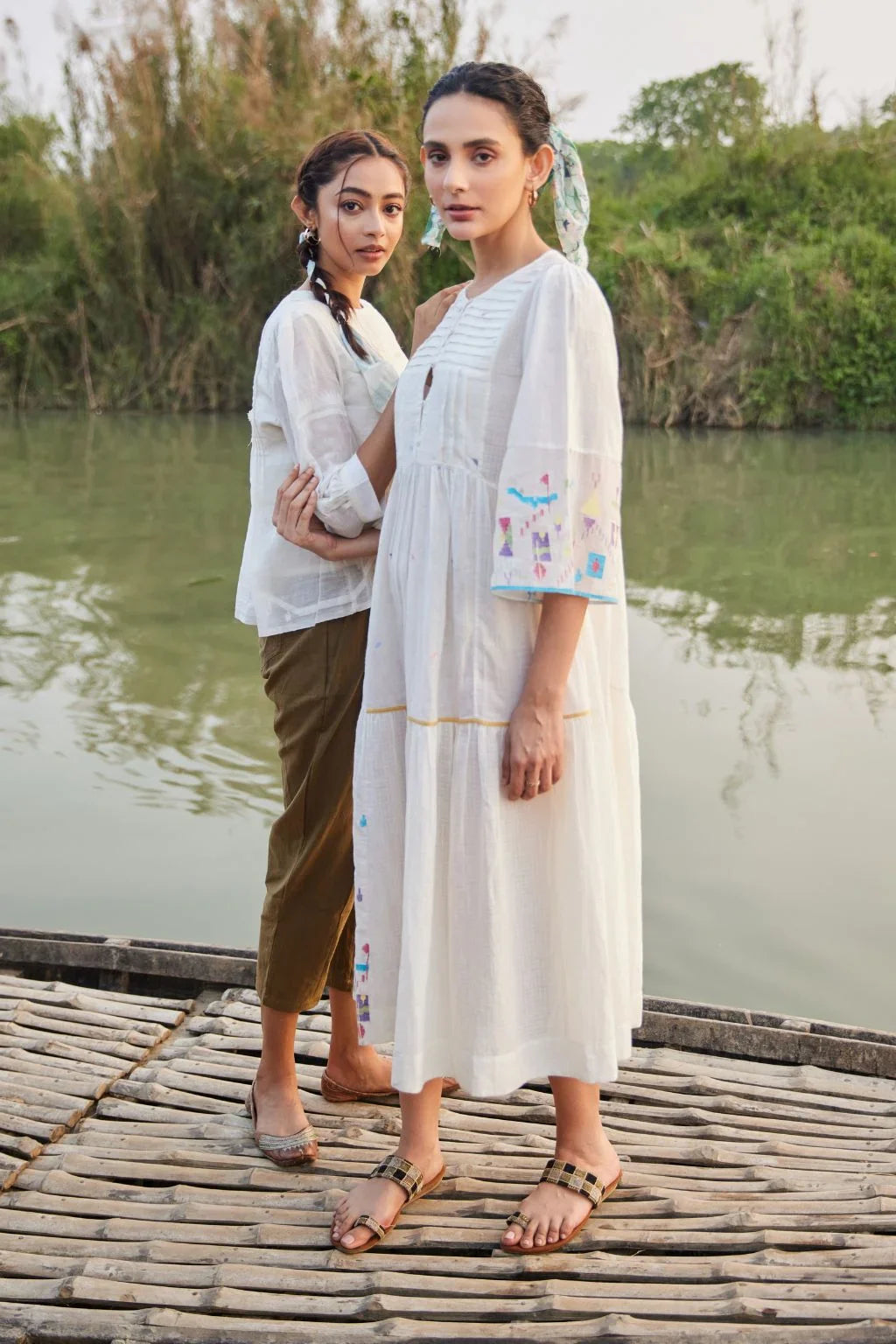 Sarron Sneha Dress, white cotton Jamdani dress with a pleated fall, round neck and waist smocking.