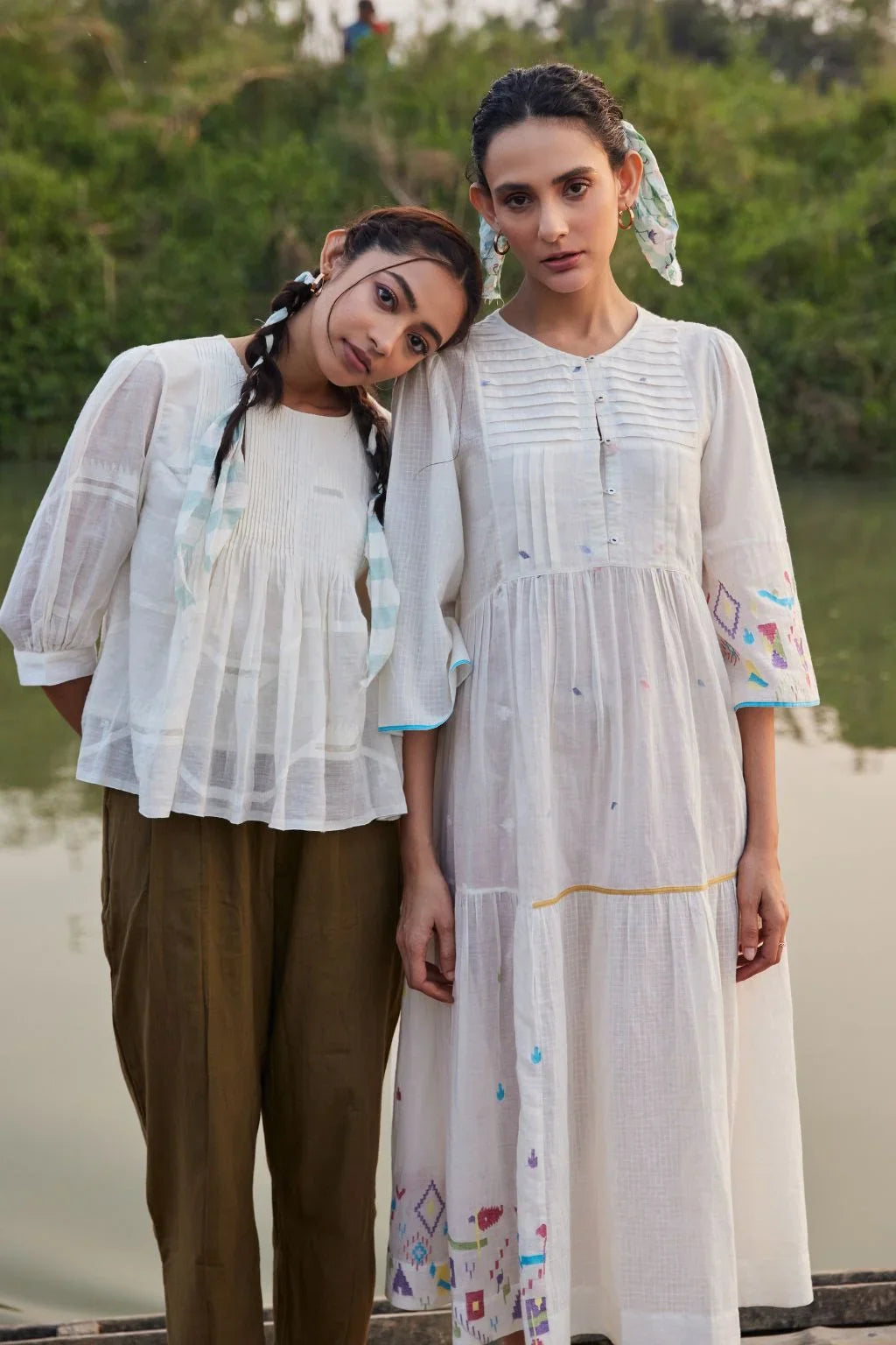 Sarron Sneha Dress, white cotton Jamdani dress with a pleated fall, round neck and waist smocking.