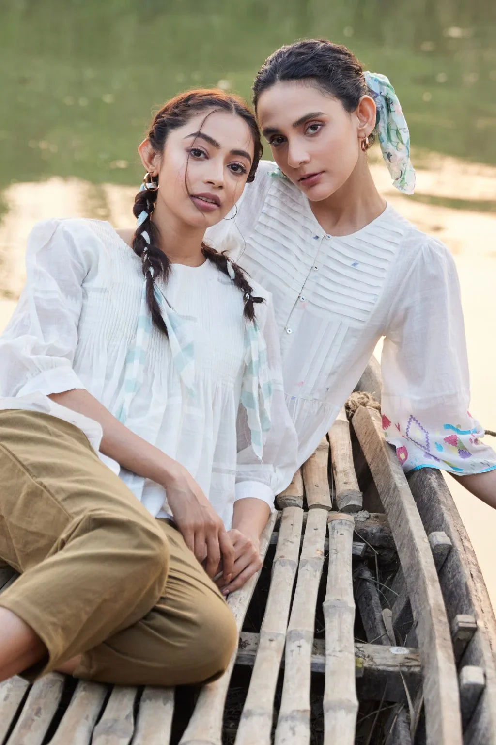 Sarron Sneha Dress, white cotton Jamdani dress with a pleated fall, round neck and waist smocking.